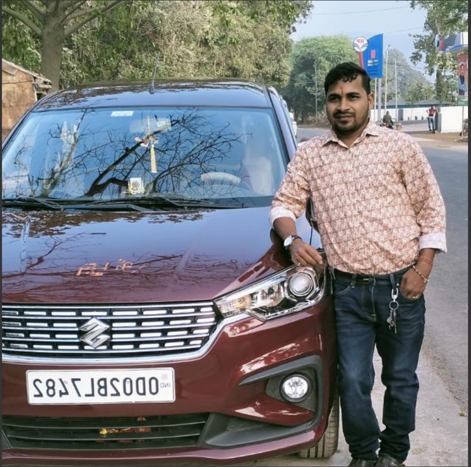 A headshot of a satisfied customer with a big smile