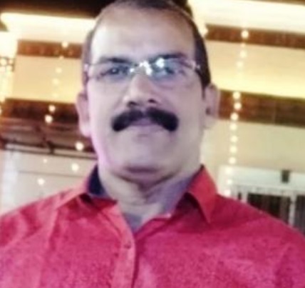 A headshot of a satisfied customer with a big smile